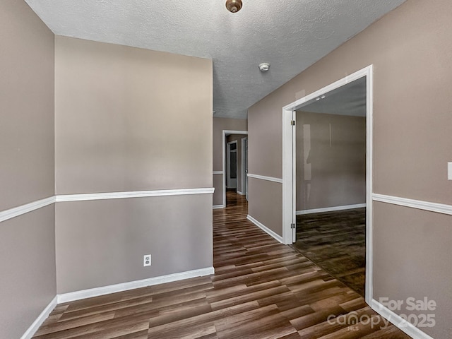 361 Settlemyer Rd, Morganton, NC 28655 - hall with wood finished floors, baseboards, and a textured ceiling