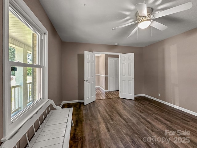 361 Settlemyer Rd, Morganton, NC 28655 - unfurnished bedroom featuring baseboards, dark wood-type flooring, and ceiling fan