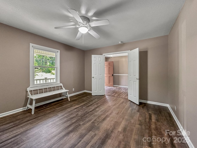 361 Settlemyer Rd, Morganton, NC 28655 - unfurnished bedroom with wood finished floors, baseboards, a textured ceiling, and ceiling fan