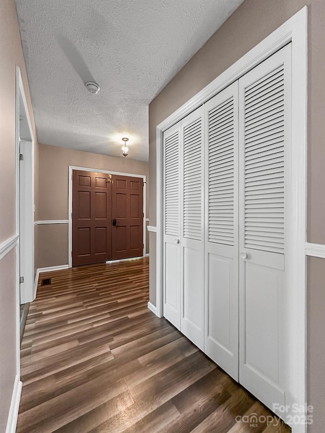 361 Settlemyer Rd, Morganton, NC 28655 - hallway with dark wood-style flooring, a textured ceiling, and baseboards