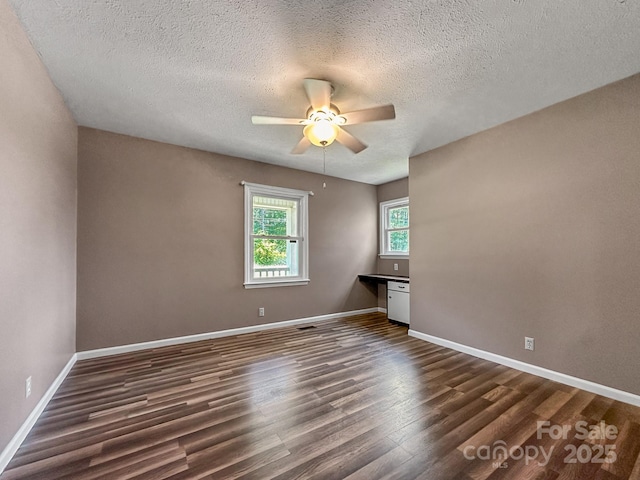 361 Settlemyer Rd, Morganton, NC 28655 - empty room featuring dark wood-style flooring, a ceiling fan, a textured ceiling, and baseboards