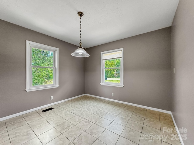 361 Settlemyer Rd, Morganton, NC 28655 - spare room featuring healthy amount of natural light, baseboards, and light tile patterned flooring