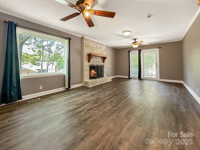 361 Settlemyer Rd, Morganton, NC 28655 - unfurnished living room featuring a ceiling fan, ornamental molding, dark wood finished floors, a fireplace, and baseboards