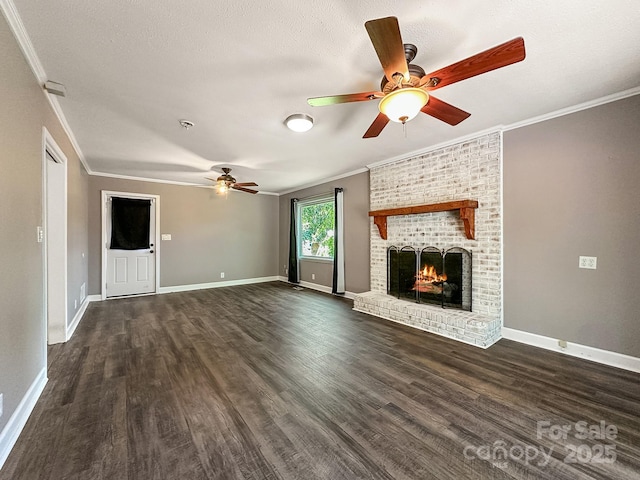 361 Settlemyer Rd, Morganton, NC 28655 - unfurnished living room with ceiling fan, crown molding, dark wood finished floors, a fireplace, and baseboards