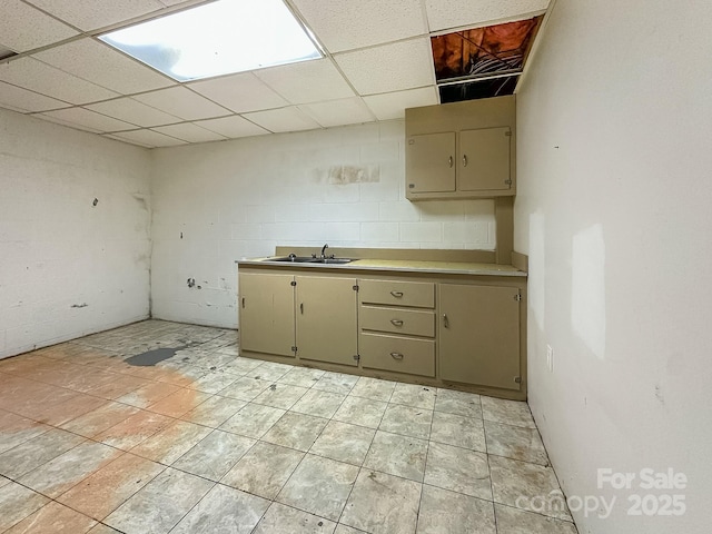 361 Settlemyer Rd, Morganton, NC 28655 - kitchen with a paneled ceiling, light countertops, a sink, and cream cabinetry
