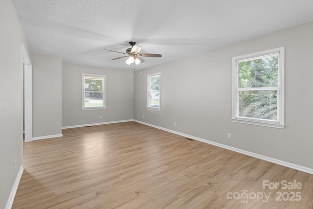 219 Proctor Dr, Salisbury, NC 28147 - empty room featuring a ceiling fan, light wood-style floors, and baseboards