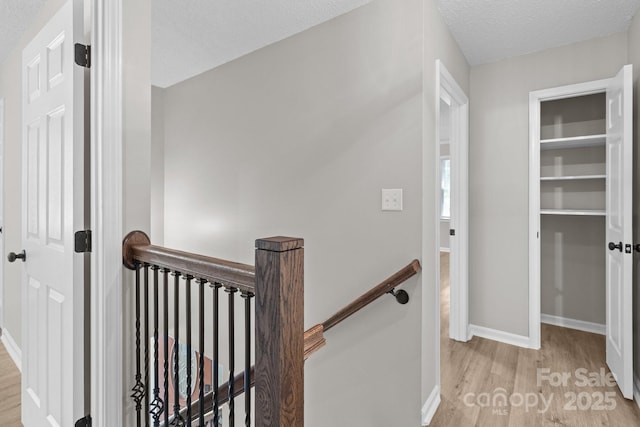219 Proctor Dr, Salisbury, NC 28147 - hall with an upstairs landing, wood finished floors, and baseboards