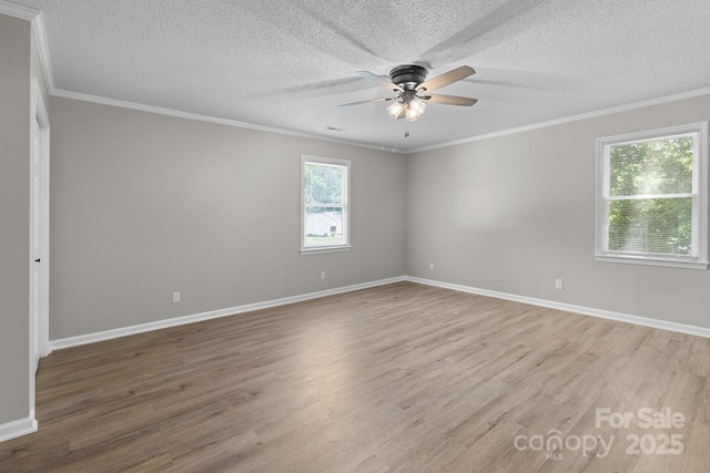 219 Proctor Dr, Salisbury, NC 28147 - empty room with ceiling fan, light wood finished floors, crown molding, baseboards, and a textured ceiling