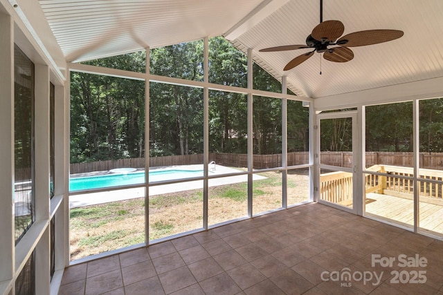 219 Proctor Dr, Salisbury, NC 28147 - unfurnished sunroom with vaulted ceiling, a ceiling fan, and healthy amount of natural light