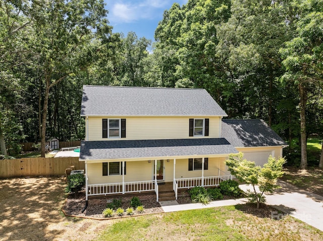 219 Proctor Dr, Salisbury, NC 28147 - view of front of property featuring covered porch, an attached garage, driveway, and a shingled roof