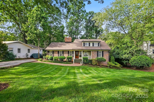 2025 Sagamore Rd, Charlotte, NC 28209 - view of front of home with brick siding, a chimney, a porch, and a front yard