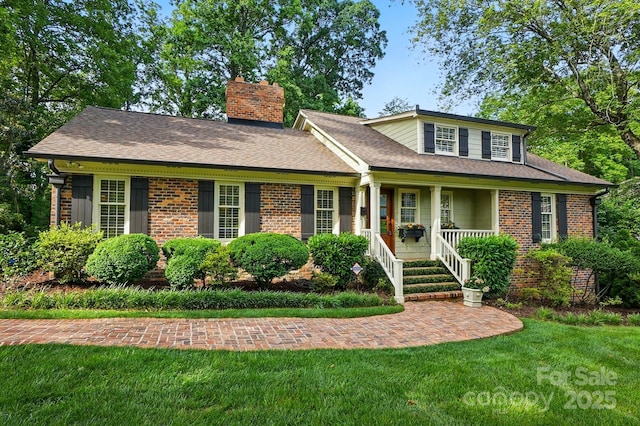2025 Sagamore Rd, Charlotte, NC 28209 - view of front of property with brick siding, a chimney, covered porch, and a front yard