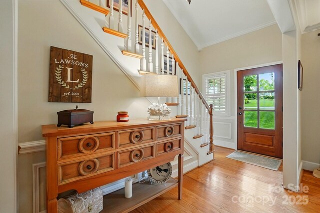 2025 Sagamore Rd, Charlotte, NC 28209 - entrance foyer featuring stairs, crown molding, and light wood-style floors