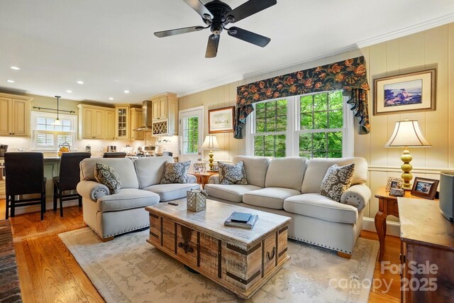 2025 Sagamore Rd, Charlotte, NC 28209 - living room with light wood-style floors, ornamental molding, ceiling fan, recessed lighting, and a decorative wall