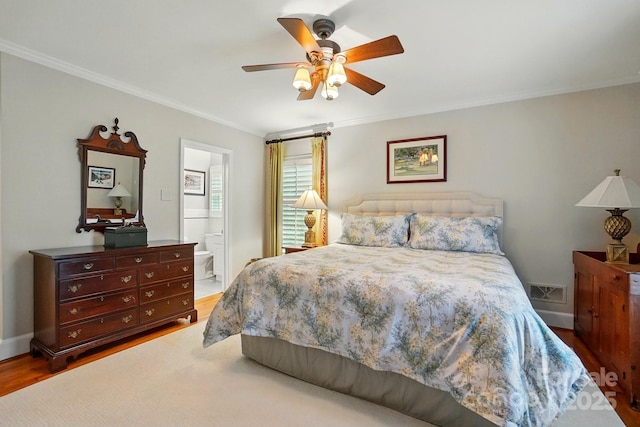 2025 Sagamore Rd, Charlotte, NC 28209 - bedroom featuring ornamental molding, wood finished floors, connected bathroom, ceiling fan, and baseboards