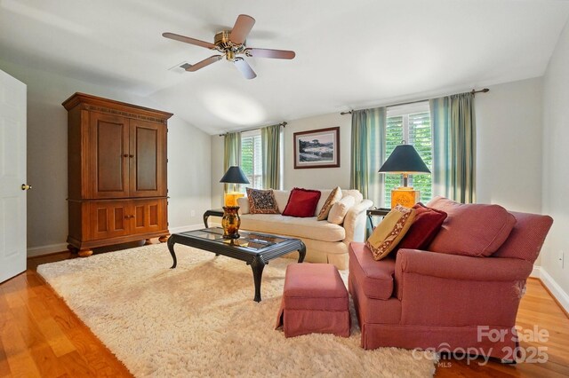 2025 Sagamore Rd, Charlotte, NC 28209 - living area with light wood-style flooring, a ceiling fan, vaulted ceiling, and baseboards