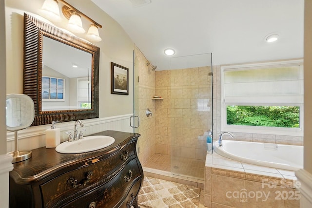2025 Sagamore Rd, Charlotte, NC 28209 - full bathroom featuring a shower stall, vaulted ceiling, a garden tub, vanity, and tile patterned floors