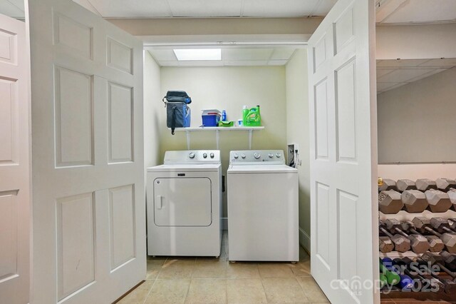 2025 Sagamore Rd, Charlotte, NC 28209 - laundry area with separate washer and dryer and light tile patterned floors