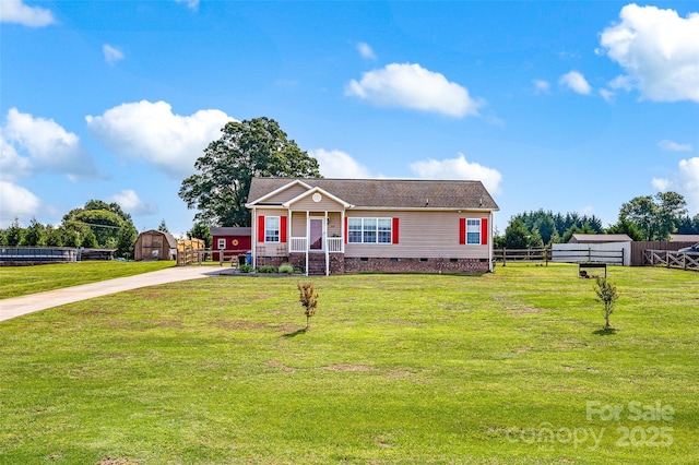 509 Brawley Rd Unit 7, Cleveland, NC 27013 - view of front of home featuring crawl space, a porch, concrete driveway, a storage shed, and an outbuilding