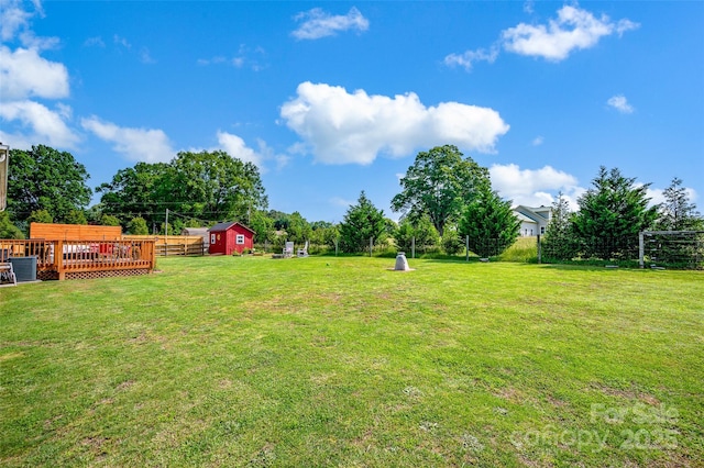 509 Brawley Rd Unit 7, Cleveland, NC 27013 - view of grassy yard with a wooden deck, an outbuilding, central AC unit, and a storage unit