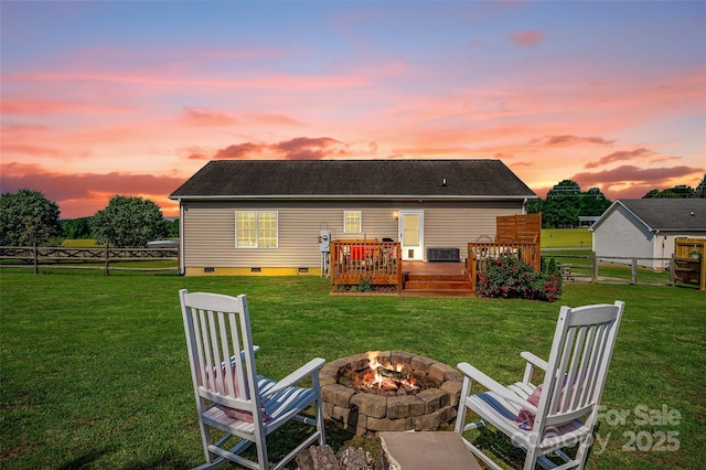 509 Brawley Rd Unit 7, Cleveland, NC 27013 - back of property at dusk featuring a fire pit, crawl space, and a wooden deck
