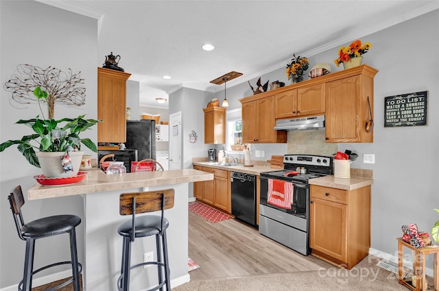 509 Brawley Rd Unit 7, Cleveland, NC 27013 - kitchen with stainless steel range with electric stovetop, dishwasher, a breakfast bar, under cabinet range hood, and light countertops