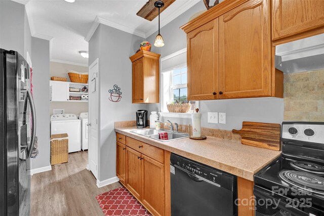 509 Brawley Rd Unit 7, Cleveland, NC 27013 - kitchen featuring stainless steel electric range, black dishwasher, a sink, washing machine and dryer, and crown molding