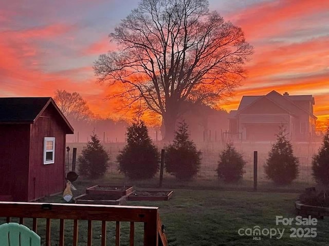 509 Brawley Rd Unit 7, Cleveland, NC 27013 - view of green lawn featuring a vegetable garden and an outbuilding