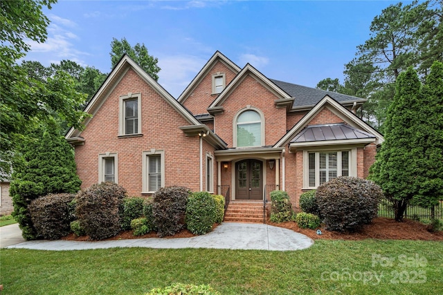 310 Ridge Reserve Dr, Clover, SC 29710 - view of front of property featuring french doors, brick siding, a standing seam roof, and roof with shingles