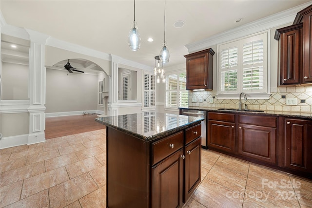 310 Ridge Reserve Dr, Clover, SC 29710 - kitchen with a sink, ornate columns, dishwasher, a ceiling fan, and decorative backsplash