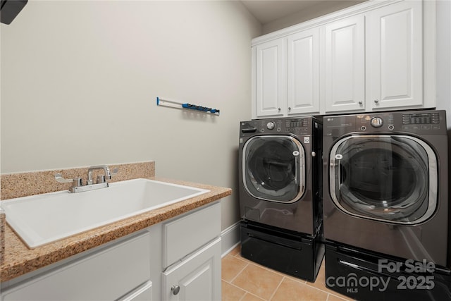 310 Ridge Reserve Dr, Clover, SC 29710 - washroom with cabinet space, washer and clothes dryer, and light tile patterned floors