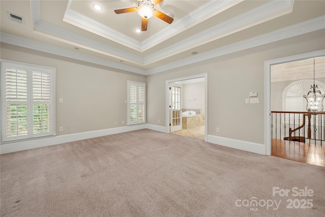 310 Ridge Reserve Dr, Clover, SC 29710 - carpeted empty room featuring ornamental molding, a ceiling fan, baseboards, a tray ceiling, and a chandelier