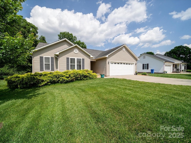 ranch-style home with a garage, driveway, and a front yard