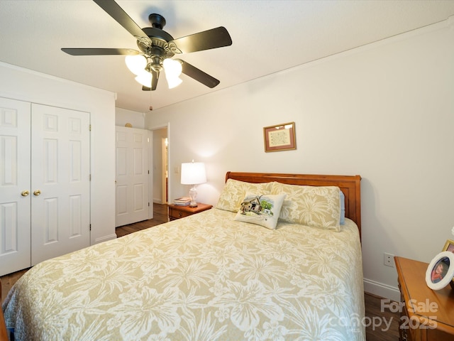 bedroom featuring wood finished floors, a closet, baseboards, and ceiling fan
