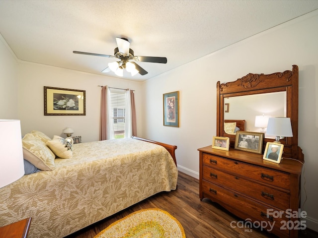 bedroom with dark wood finished floors, ceiling fan, and baseboards