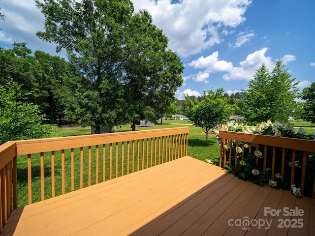 deck featuring a yard