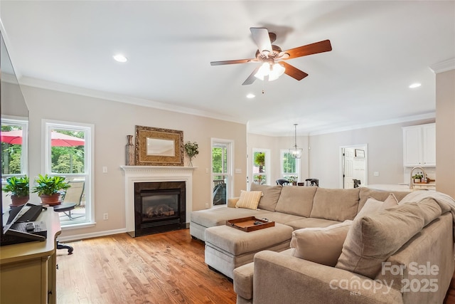 8612 Tintinhull Ln, Waxhaw, NC 28173 - living room with plenty of natural light, ornamental molding, ceiling fan, a high end fireplace, and recessed lighting