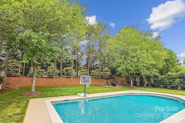 8612 Tintinhull Ln, Waxhaw, NC 28173 - swimming pool featuring a lawn and view of scattered trees