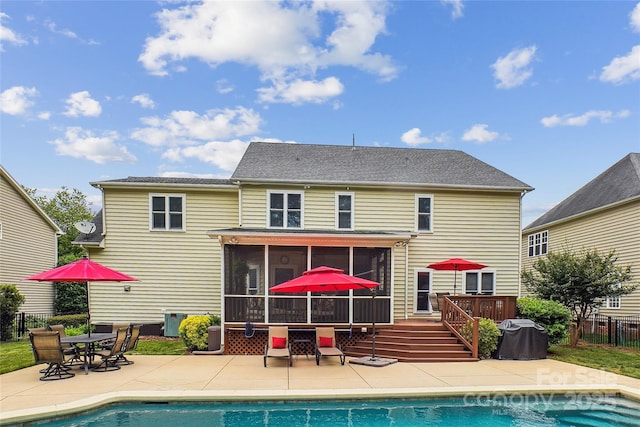 8612 Tintinhull Ln, Waxhaw, NC 28173 - back of property with a sunroom, a patio, outdoor dining area, and a deck