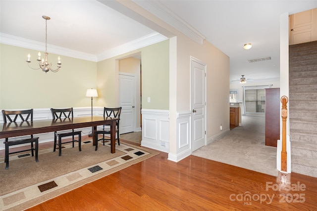 2324 Bonterra Blvd, Indian Trail, NC 28079 - home office featuring a chandelier, ornamental molding, wood finished floors, ceiling fan, and wainscoting