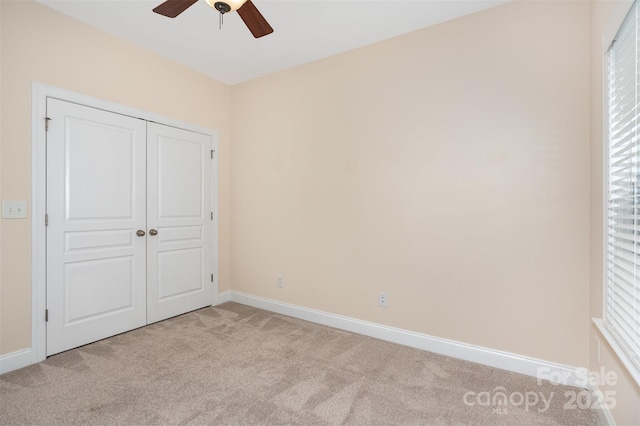2324 Bonterra Blvd, Indian Trail, NC 28079 - unfurnished bedroom featuring light carpet, baseboards, a closet, and a ceiling fan
