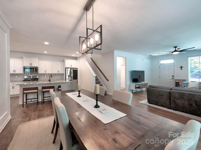 dining room with dark wood-style flooring, recessed lighting, stairs, and ceiling fan