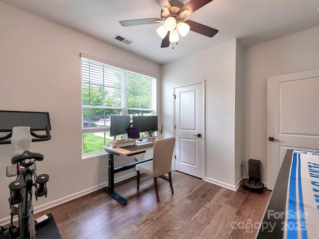office space with wood finished floors, a ceiling fan, and baseboards