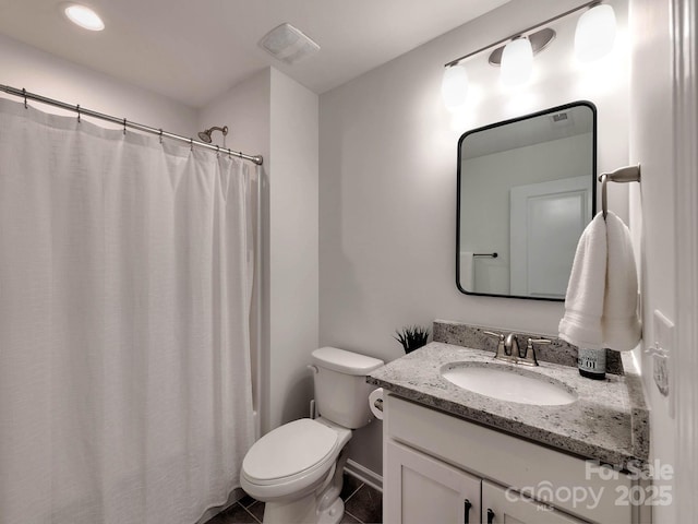 bathroom with tile patterned flooring, vanity, toilet, baseboards, and curtained shower