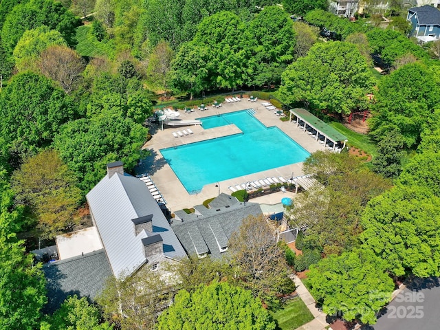 aerial view of property's location with a pool area