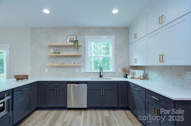 1025 Harrogate Dr, Bessemer City, NC 28016 - kitchen with stainless steel appliances, a sink, white cabinets, light countertops, and recessed lighting
