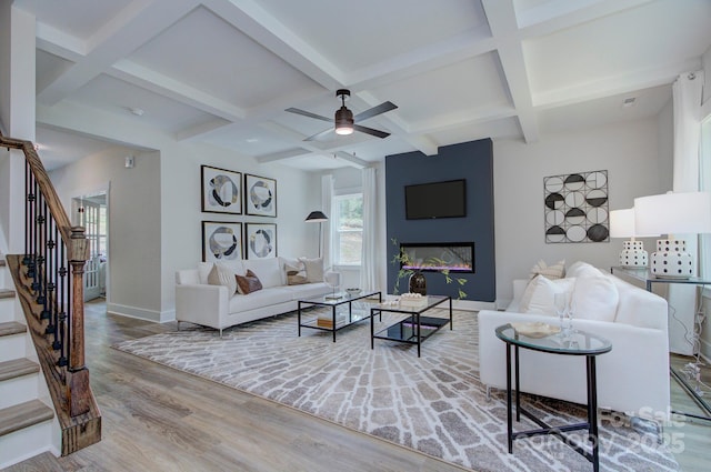 1025 Harrogate Dr, Bessemer City, NC 28016 - living area featuring stairs, wood finished floors, coffered ceiling, beamed ceiling, and baseboards