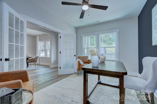 1025 Harrogate Dr, Bessemer City, NC 28016 - home office with french doors, healthy amount of natural light, light wood finished floors, and ceiling fan