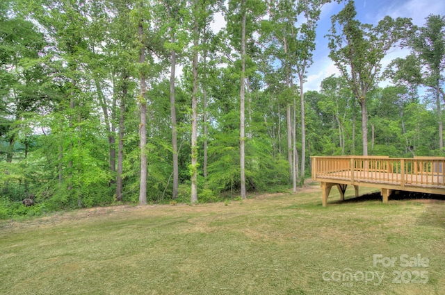 1025 Harrogate Dr, Bessemer City, NC 28016 - view of grassy yard with a deck and a forest view