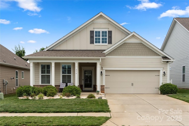 274 Robinwood Ln, Lake Wylie, SC 29710 - craftsman inspired home with board and batten siding, concrete driveway, covered porch, a front yard, and stone siding